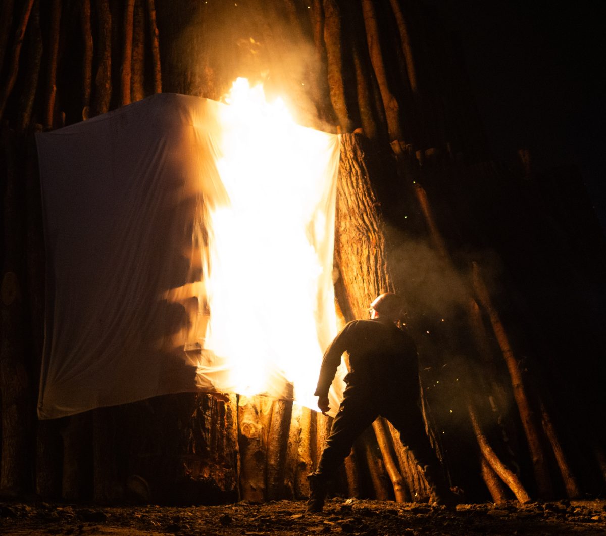 A red pot lights the stack at the student bonfire on Tuesday, Nov. 21, 2023.