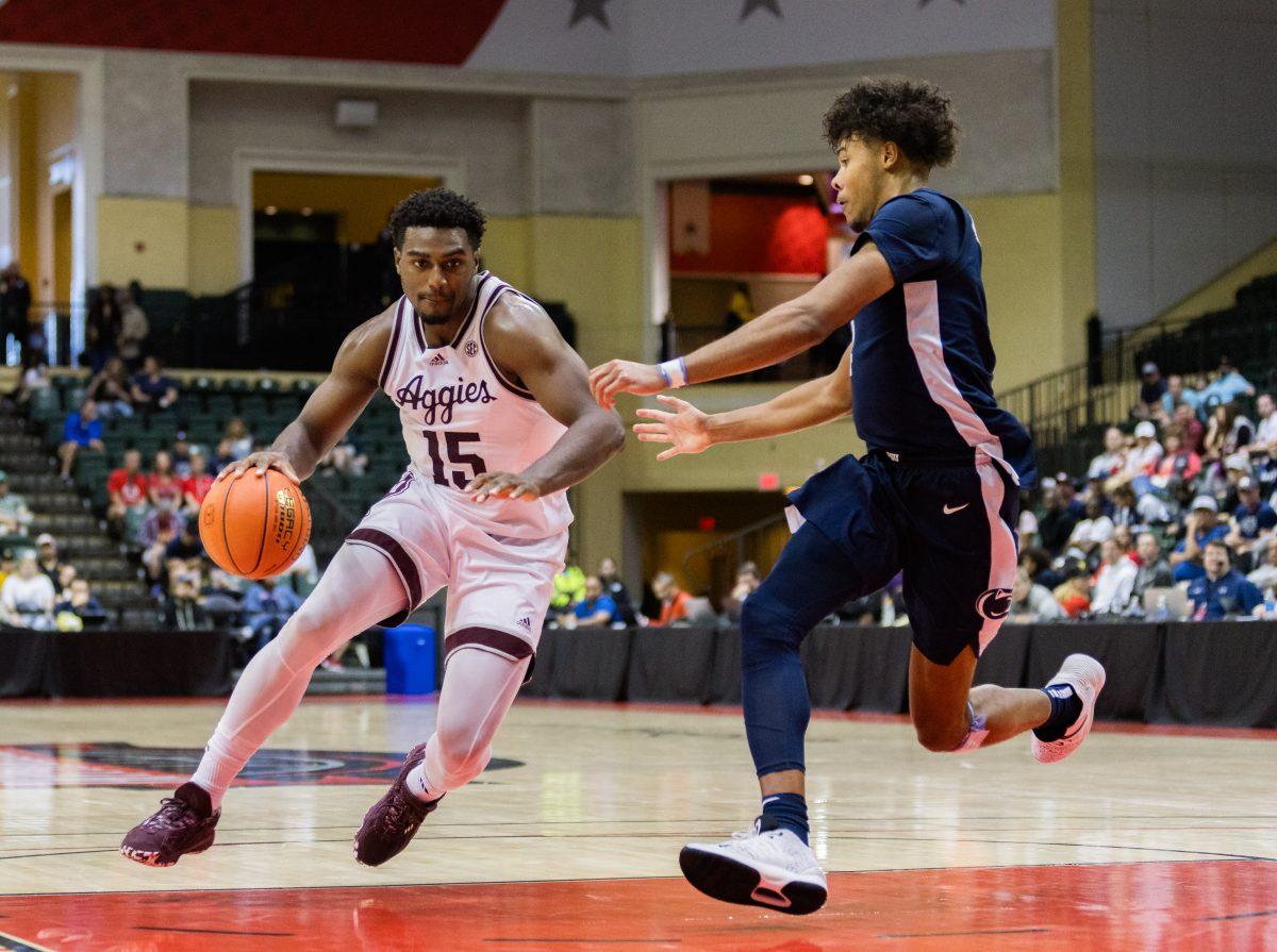 Senior F Henry Coleman III (15) drives to the basket for an one-1 during Texas A&amp;M's game against Penn State at the ESPN Events Invitational in Kissimmee, Florida on Thursday, Nov. 23, 2023.