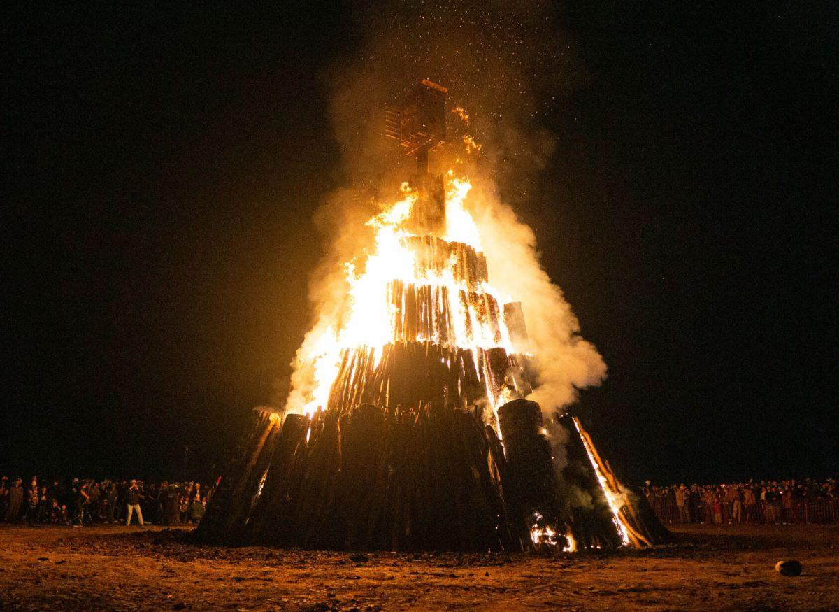 Aggies watch on as the stack burns bright at Student Bonfire's Burn on Tuesday, Nov. 21, 2023.