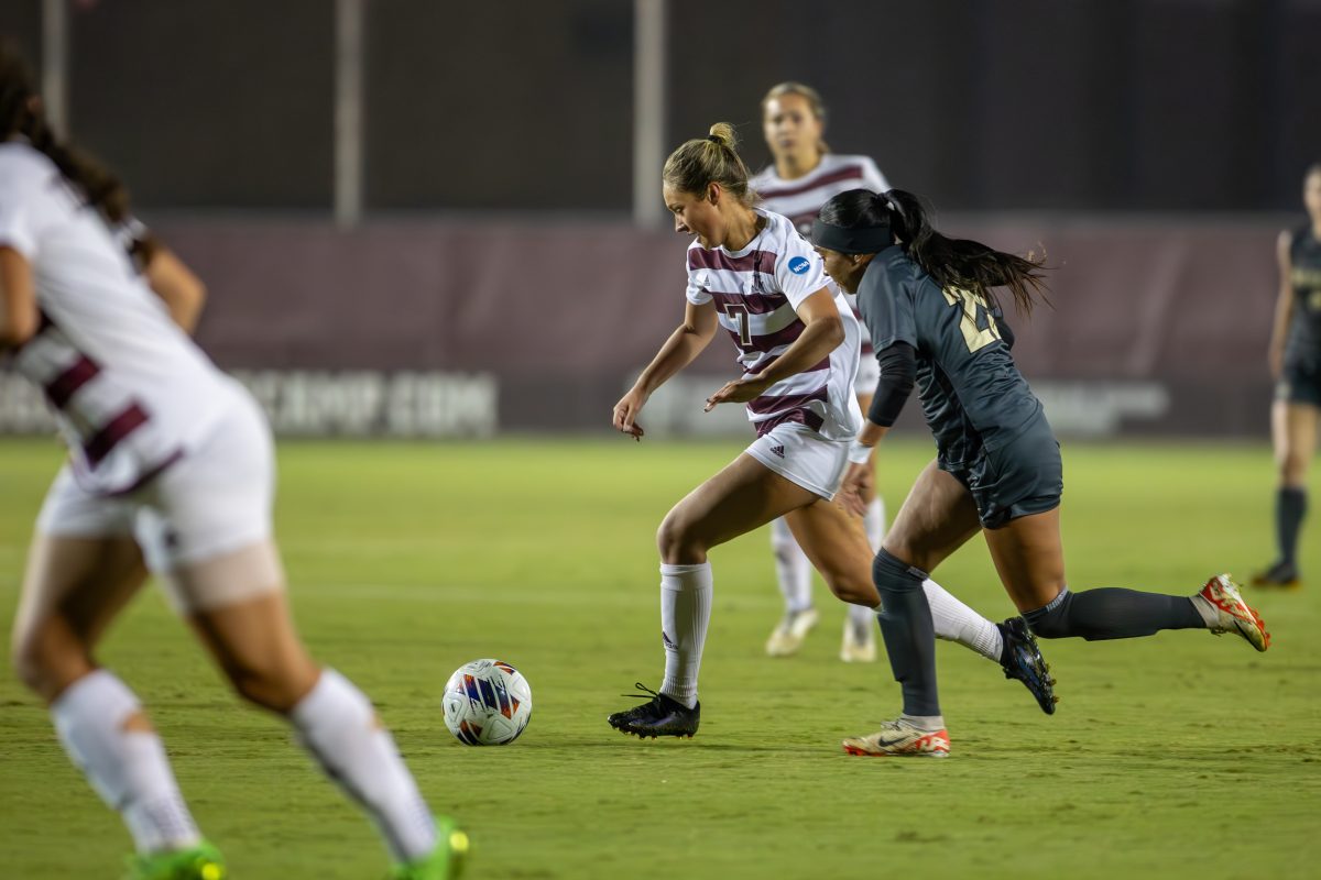 Sophomore M Sydney Becerra (7) dribbles the ball past Colorado defenders during Texas A&amp;M's game against Colorado on Friday, Nov. 10, 2023 at Ellis Field. (CJ Smith/The Battalion)