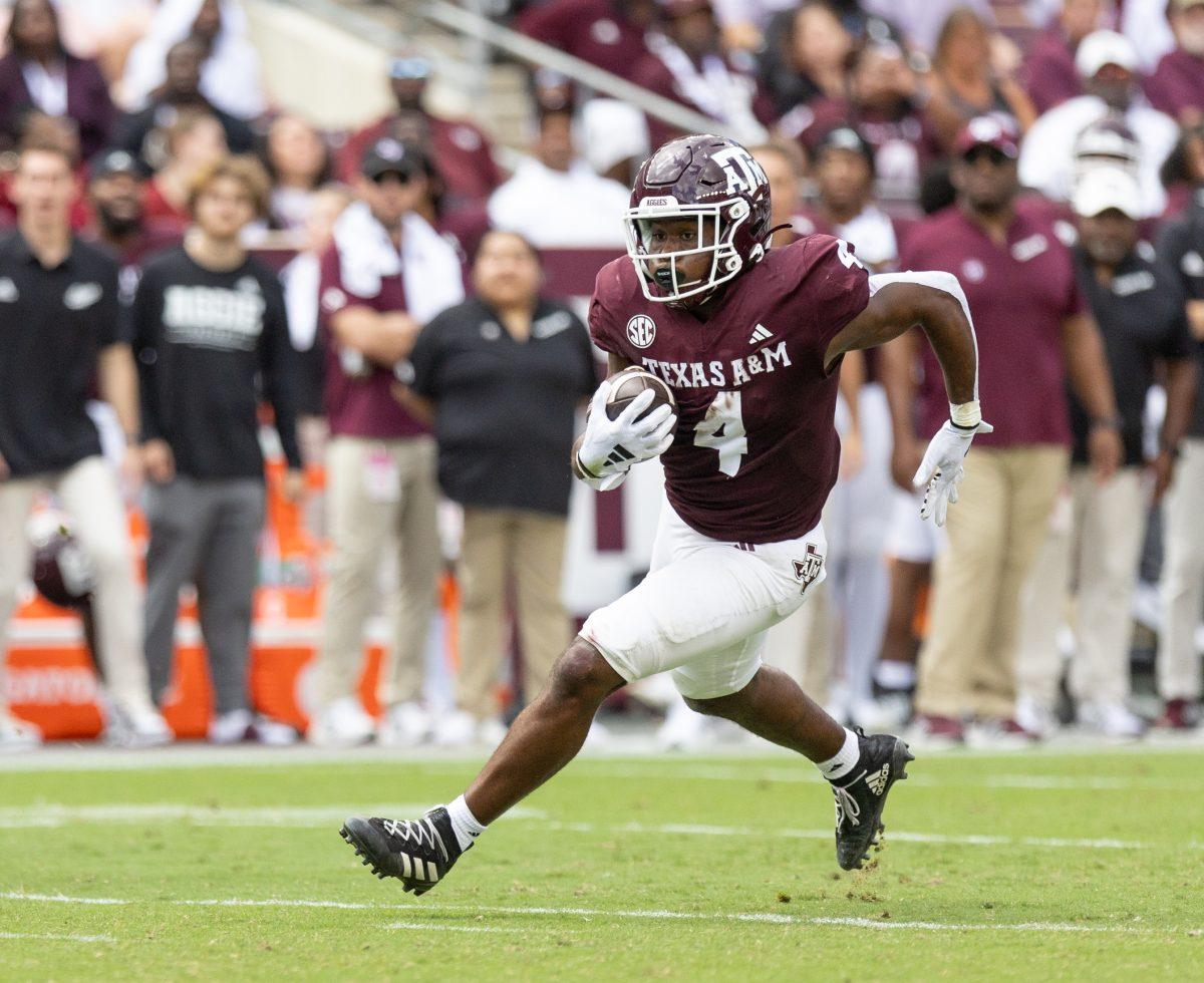 Junior RB Amari Daniels (4) runs with the ball during Texas A&Ms game against South Carolina on Saturday, Oct. 28, 2023 at Kyle Field (Katelynn Ivy/The Battalion).