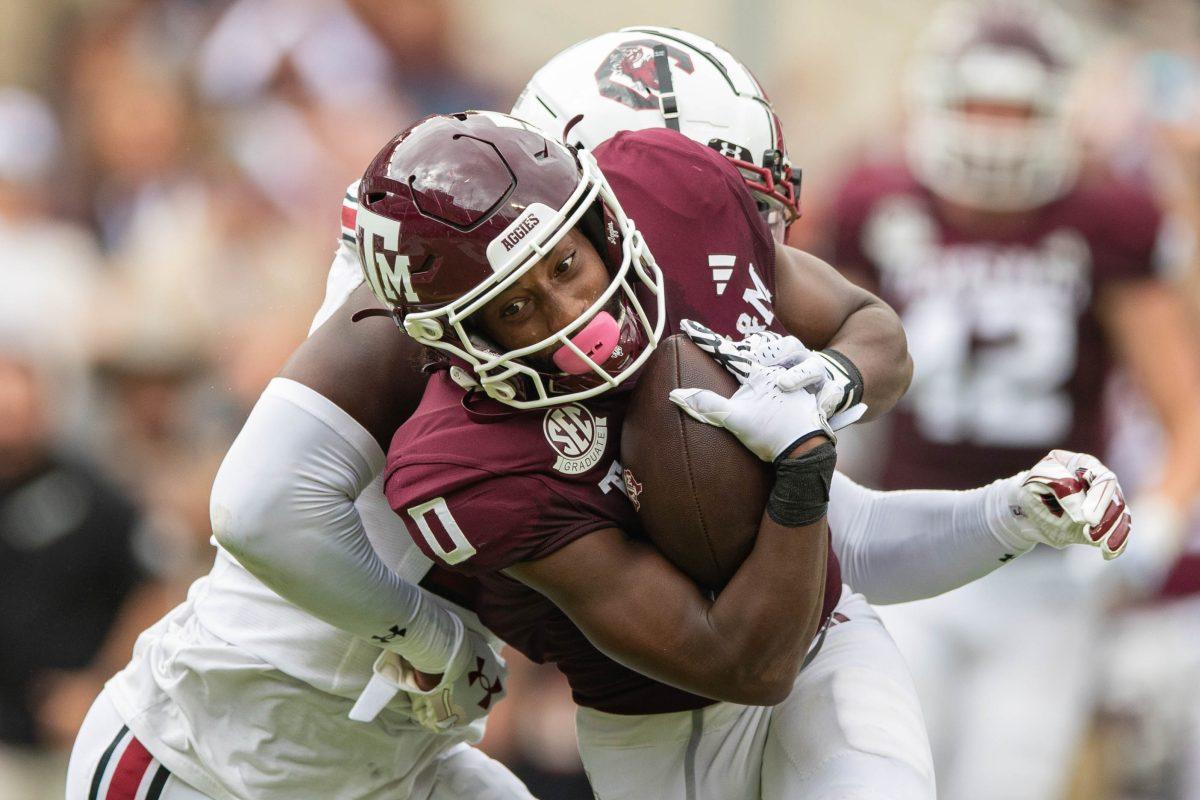 Graduate WR Ainias Smith (0) breaks a tackle during Texas A&Ms game vs. South Carolina at Kyle Field on Saturday, Oct. 28, 2023.