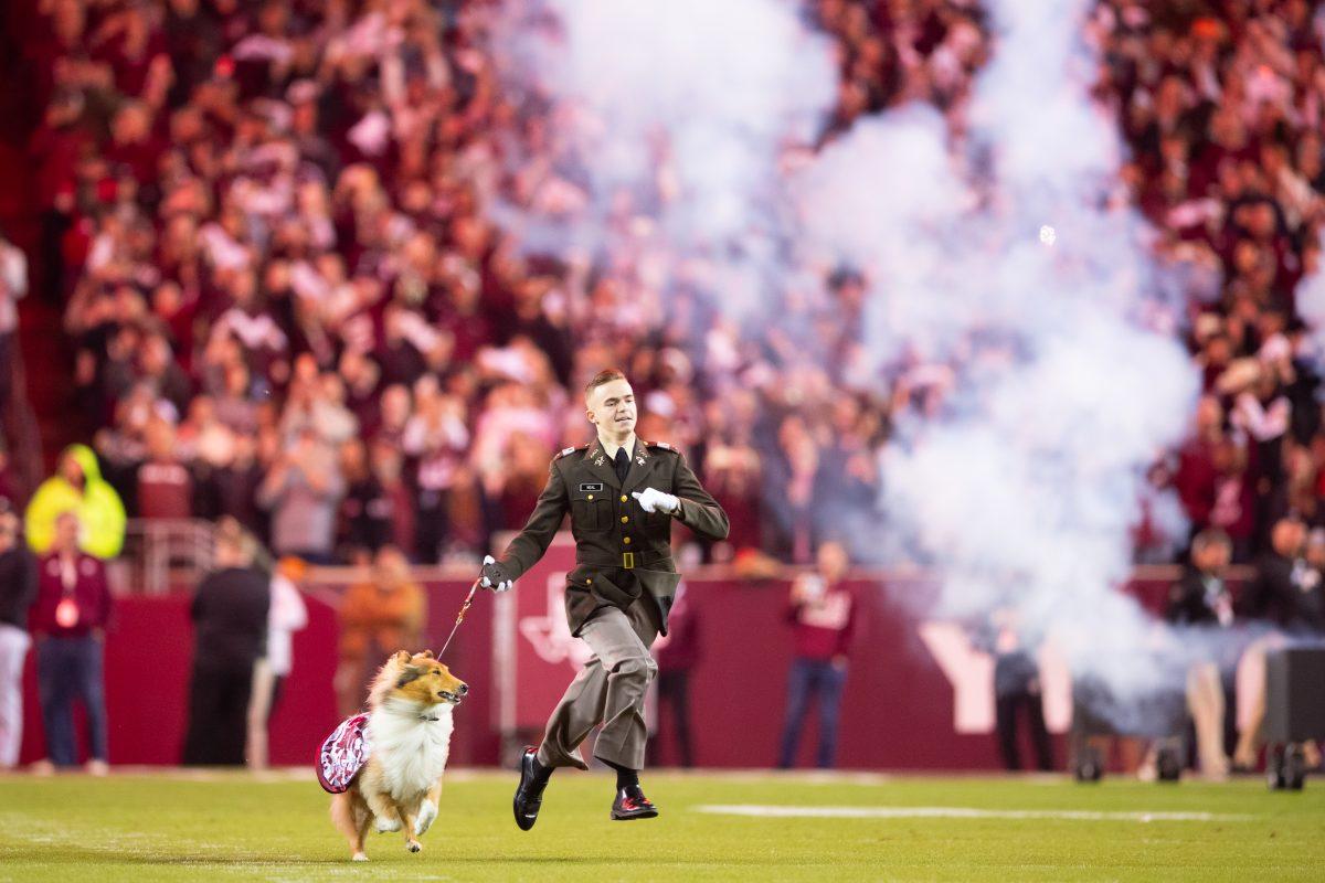 Sophomore Theodore Neal runs out with Reveille ahead of Texas A&Ms game against Mississippi State on Saturday, Nov. 11, 2023 at Kyle Field. (Julianne Shivers/ The Battalion)