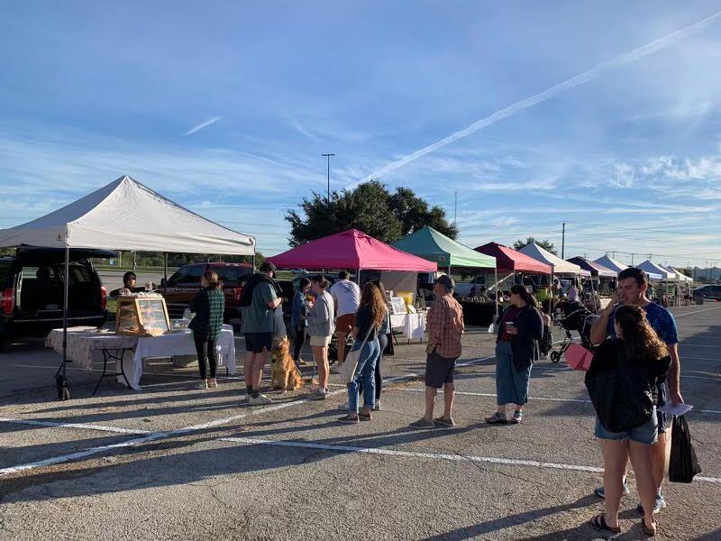 People line up during the Farmers Market in College Station, Texas. 