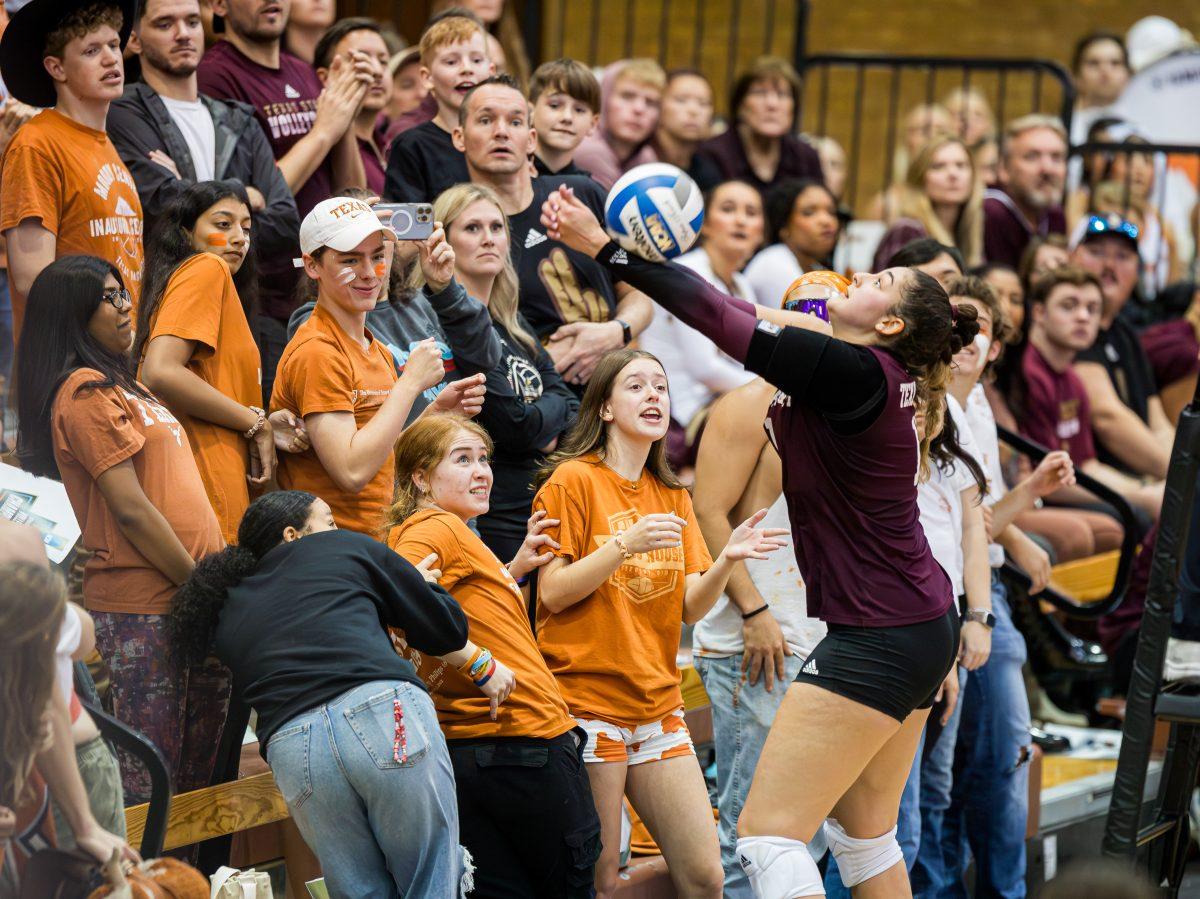 <p>Junior S Nisa Buzlutepe (11) saves the ball from falling out of bounds during the second set of Texas A&M's game against Texas on Thursday, Nov. 30, 2023. The Longhorns took the second set 25-13. (Ishika Samant/The Battalion)</p>