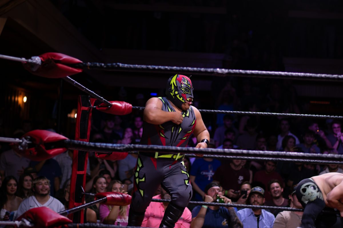 A mini masked wrestler barrels towards Lil Tucker at Extreme Dwarfanators Wresting in Shiner Park on Nov 17, 2023 (Adriano Espinosa/The Battalion).