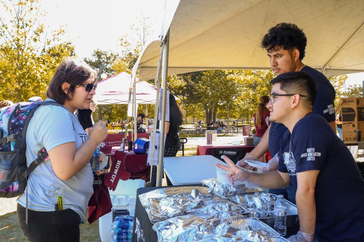 Senior Aaron Sandoval and sophomore Sebastian Martinez passes out breakfast tacos to students at the First-Generation Celebration Bash on Tuesday, Nov. 7, 2023.