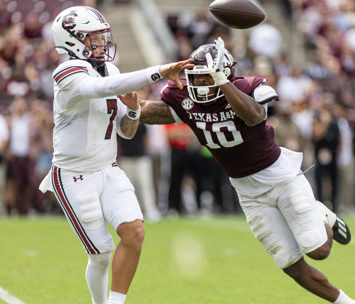 unior DL Fadil Diggs (10) attempts to sack South Carolina QB Spencer Rattler (7) during Texas A&Ms game against South Carolina on Saturday, Oct. 28, 2023 at Kyle Field (Katelynn Ivy/The Battalion).