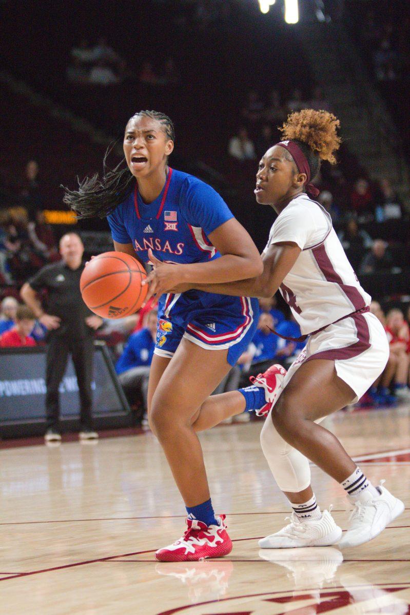 <p>Senior G Kay Kay Green (4) reaches for the ball during Texas A&M's game against Kansas on Sunday, Dec. 3, 2023 at Reed Arena. (Ahsan Yahya/The Battalion)</p>