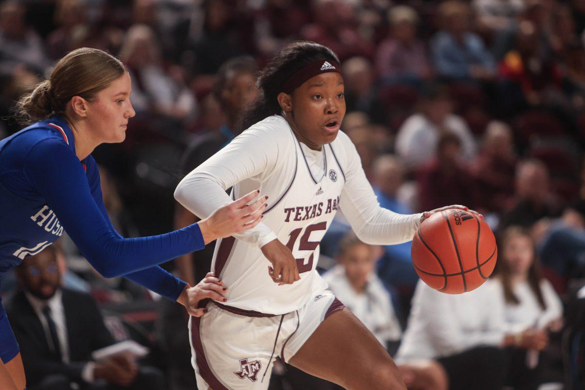 Freshman G Sole Williams (15) dribbles the ball during Texas A&Ms womens basketball game against HCU on Nov. 20, 2023 at Reed Arena.