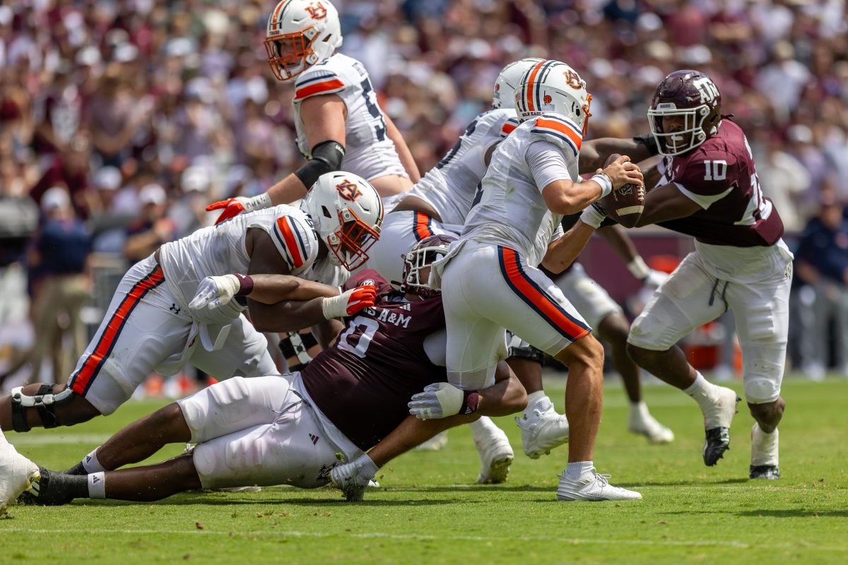 Sophomore DL Walter Nolen (0) and junior DL Fadil Diggs (10) combine for a sack during Texas A&Ms game against Auburn on Saturday, Sept. 23, 2023 at Kyle Field. (CJ Smith/The Battalion)
