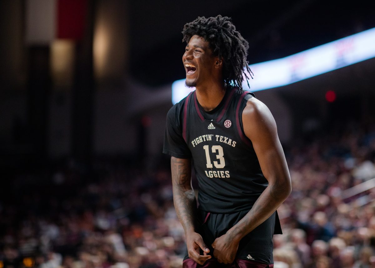 Sophomore F Solomon Washington (13) laughs at the HCU team after a techincal foul on Friday, Dec. 22, 2023 at Reed Arena. (Ishika Samant/The Battalion)