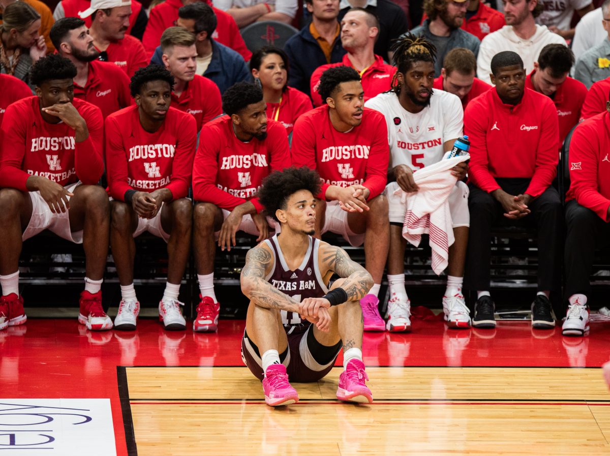 Senior F Andersson Garcia (11) sits on the sidelines during Texas A&Ms game against Houston on Saturday, Dec. 16, 2023 at the Toyota Center in Houston, Texas.