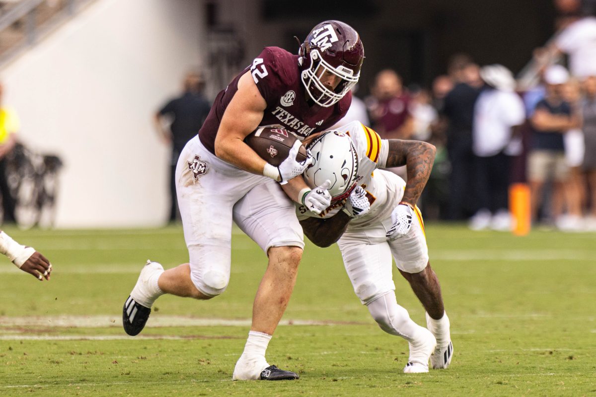 Graduate TE Max Wright (42) gets tackled during Texas A&amp;M's game against ULM at Kyle Field on Saturday, Sept. 16, 2023.