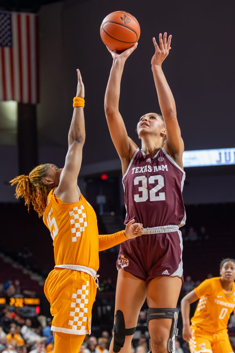 Junior F Lauren Ware (32) attempts a jump shot over a Tennessee defender during A&Ms game against Tennessee on Sunday, Jan. 14, 2024 at Reed Arena. (CJ Smith/The Battalion)