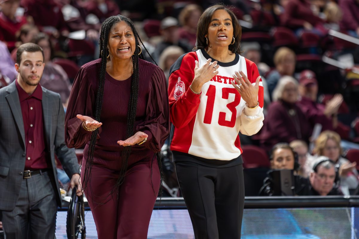 Head Coach Joni Taylor and Assistant Head Coach Chelsea Newton react to a foul call during A&Ms game against Tennessee on Sunday, Jan. 14, 2024 at Reed Arena. (CJ Smith/The Battalion)