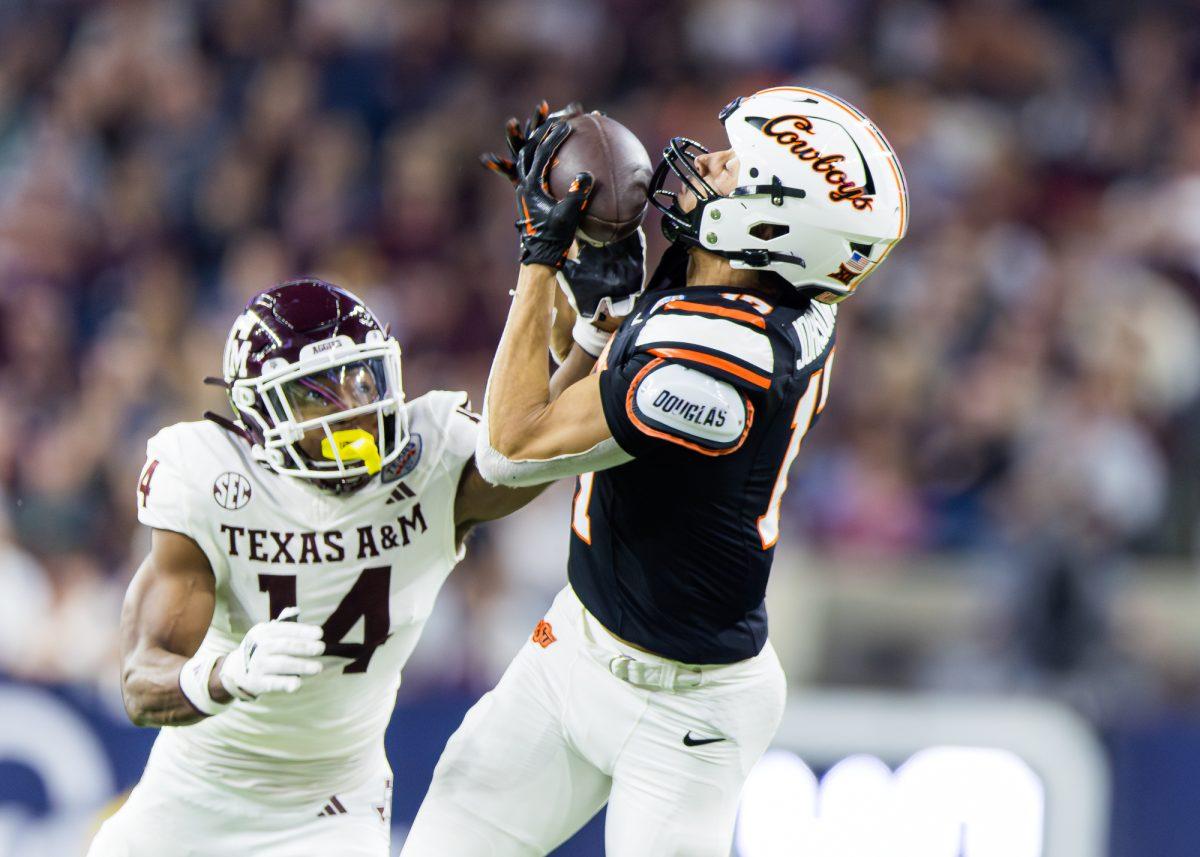 Oklahoma State WR 
Leon Johnson III (17) catches the ball during the Texas Bowl against Oklahoma State on Wednesday, Dec. 27, 2023 at NRG Statdium in Houston, Texas. (Ishika Samant/The Battalion)