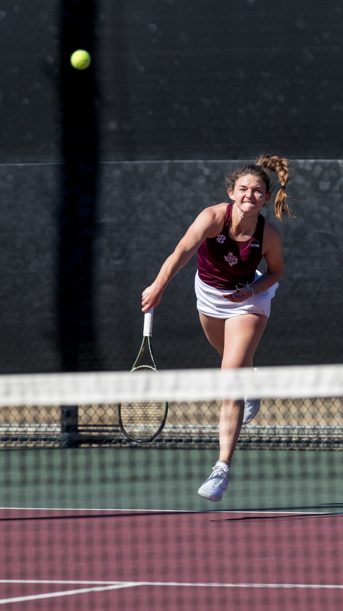 Sophomore Nicole Khirin hits an overhand during Texas A&Ms match against TCU on Sunday, Jan. 28, 2024, at the Mitchell Tennis Center. (Connor May/The Battalion)