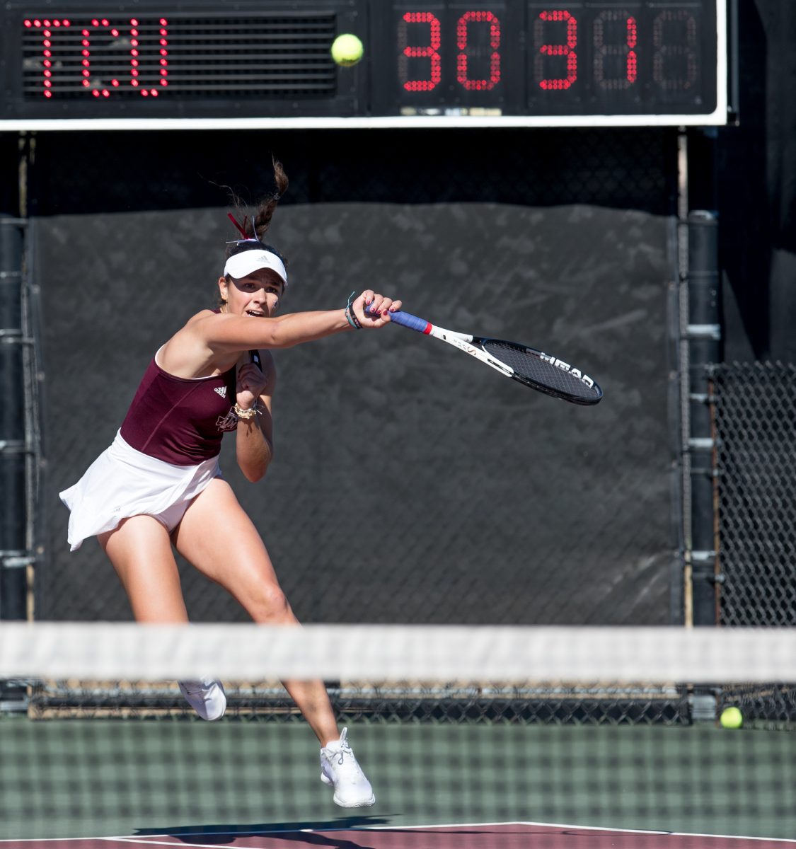 Sophomore Mia Kupres returns the ball during Texas A&M's match against TCU on Sunday, Jan. 28, 2024, at the Mitchell Tennis Center. (Connor May/The Battalion)
