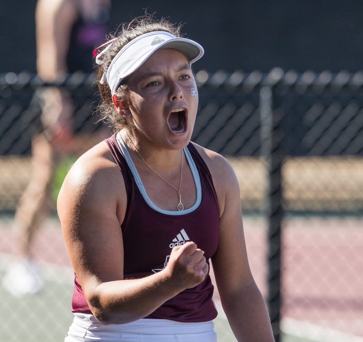 Freshman Lucciana Perez reacts after forcing match point during Texas A&Ms match against TCU on Sunday, Jan. 28, 2024, at the Mitchell Tennis Center. (Connor May/The Battalion)