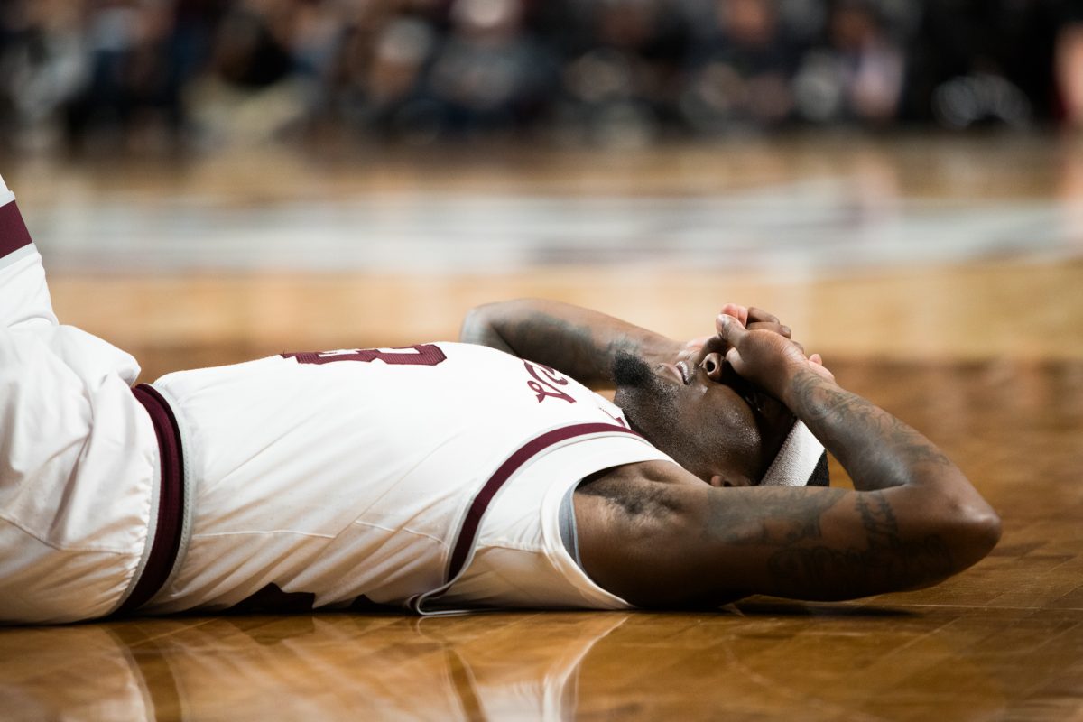Graduate G Tyrece Radford (23) sits on the floor during Texas A&Ms game against Kentucky on Saturday, Jan. 13, 2024 at Reed Arena. (Ishka Samant/The Battalion)