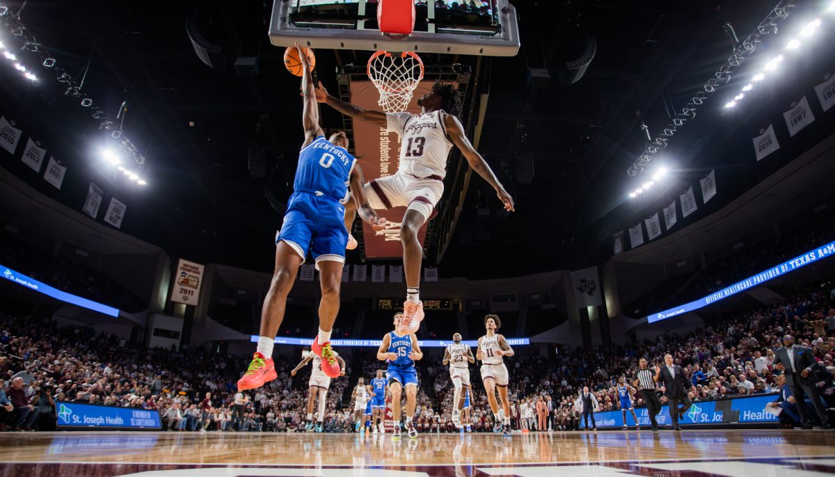 Sophomore F Solomon Washington (13) blocks Kentucky G Rob Dillingham's (0) overtime layup during Texas A&M's game against Kentucky on Saturday, Jan. 13, 2024 at Reed Arena. (Ishika Samant/The Battalion)