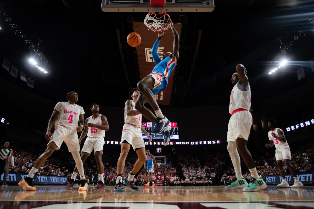 Mississippi forward Moussa Cisse (33) dunks the ball during Texas A&M’s game against Mississippi on Saturday, Jan. 27, 2024, at Reed Arena. (Ishika Samant/The Battalion)