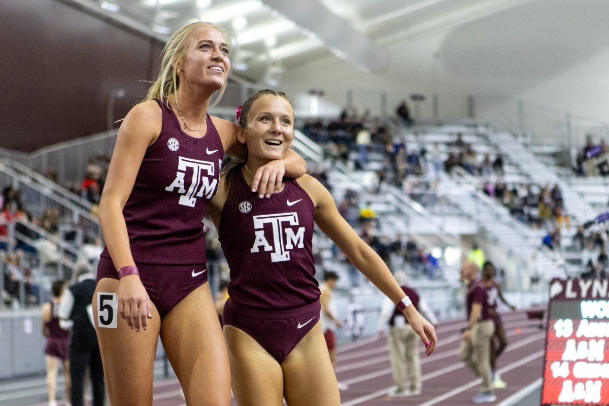 Texas A&M freshman Addison Applebaum hugs teammate after the womens 1-mile during the Ted Nelson Invitional at the Murray Fasken Indoor Track on Jan. 20, 2024. (Mattie Taylor/The Battalion)