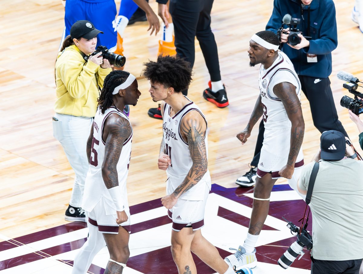 Junior G Manny Obaseki (35) celebrates with senior F Andersson Garcia (11) after Texas A&M beats Kentucky at Reed Arena on Saturday, Jan. 13, 2024.