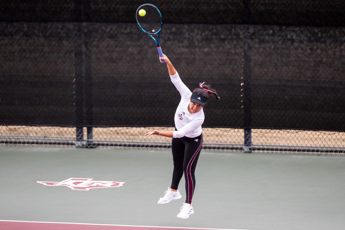 Freshman Lucciana Perez serves during Texas A&Ms doubles match against Northwestern at Mitchell Outdoor Tennis Center on Saturday, Jan. 27, 2024. (Mattie Taylor/The Battalion)