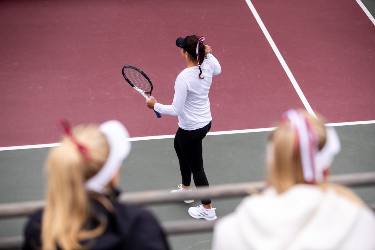 Teammates watch freshman Lucciana Perez during Texas A&Ms doubles match against Northwestern at Mitchell Outdoor Tennis Center on Saturday, Jan. 27, 2024. (Mattie Taylor/The Battalion)