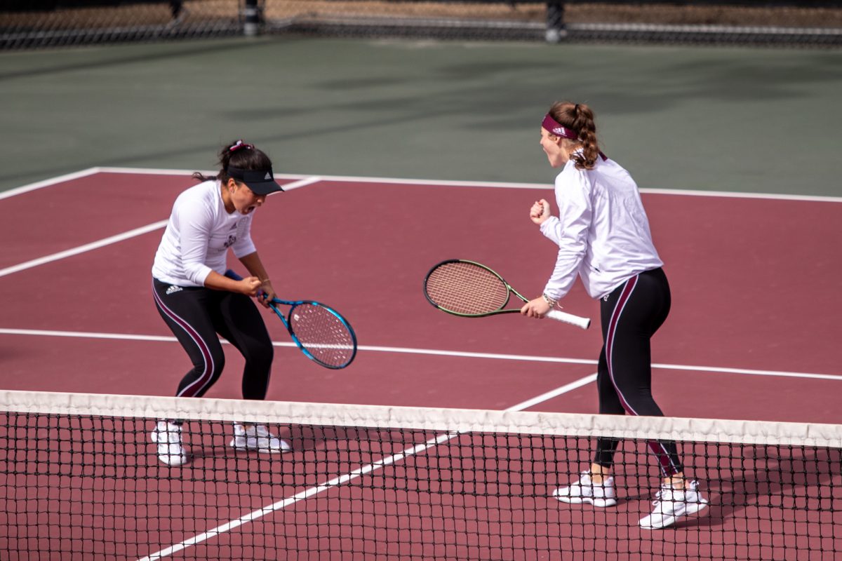 Freshman Lucciana Perez celebrates with teammate sophomore Nicole Khirin after winning a game during Texas A&Ms doubles match against Northwestern at Mitchell Outdoor Tennis Center on Saturday, Jan. 27, 2024. (Mattie Taylor/The Battalion)