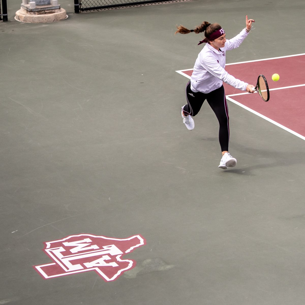 Sophomore Nicole Khirin hits during Texas A&Ms doubles match against Northwestern at Mitchell Outdoor Tennis Center on Saturday, Jan. 27, 2024. (Mattie Taylor/The Battalion)