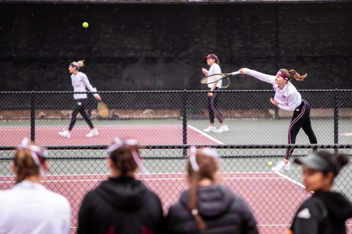 Teammates watch sophomore Nicole Khirin play after winning their match during Texas A&Ms doubles match against Northwestern at Mitchell Outdoor Tennis Center on Saturday, Jan. 27, 2024. (Mattie Taylor/The Battalion)