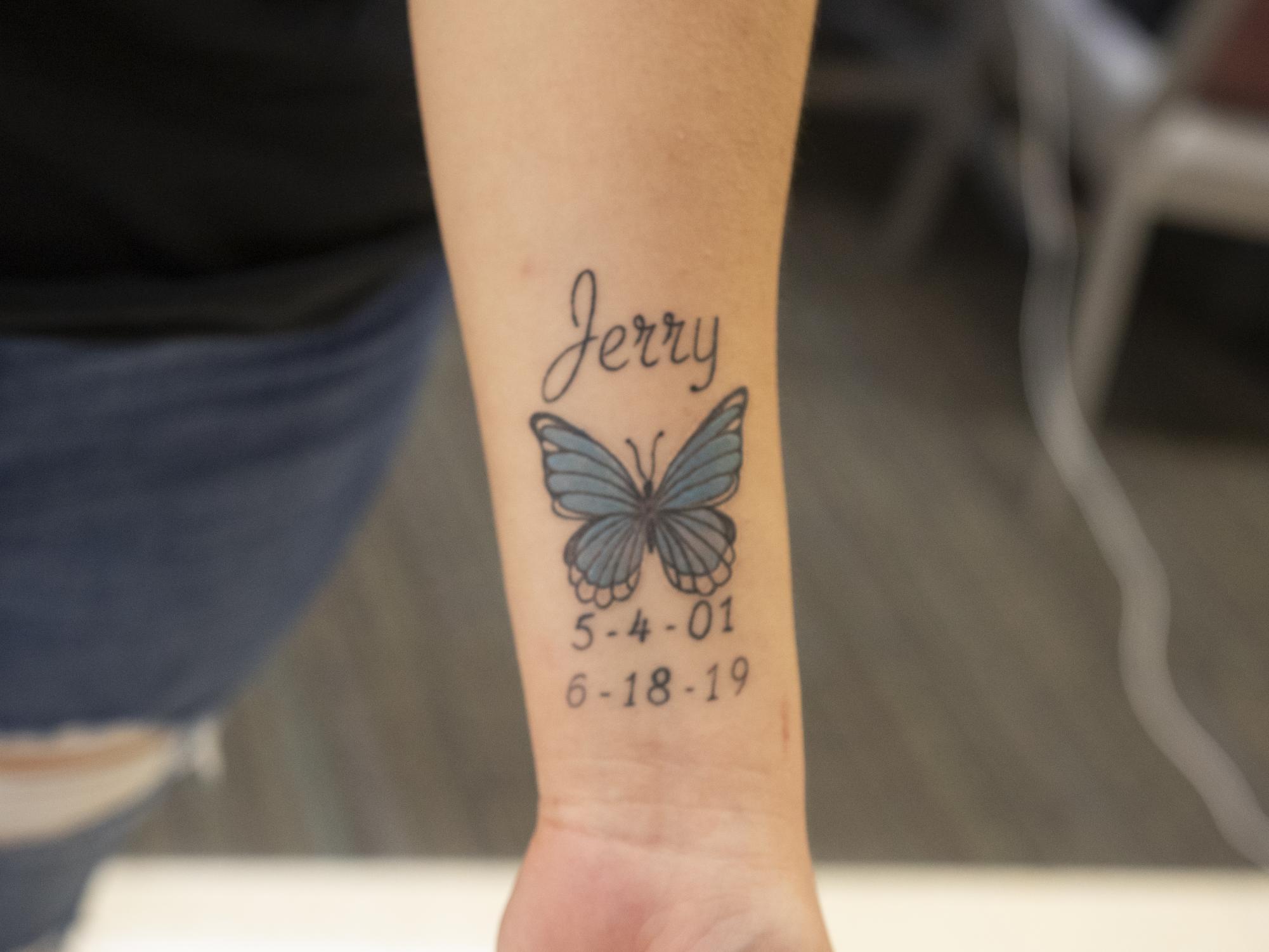 Engineering freshman Karyme Perez shows a tattoo of a butterfly that she got for her late brother. Photo on Thursday, Feb. 15, 2024. (Photo by Rebecca Cervantes/The Battalion)