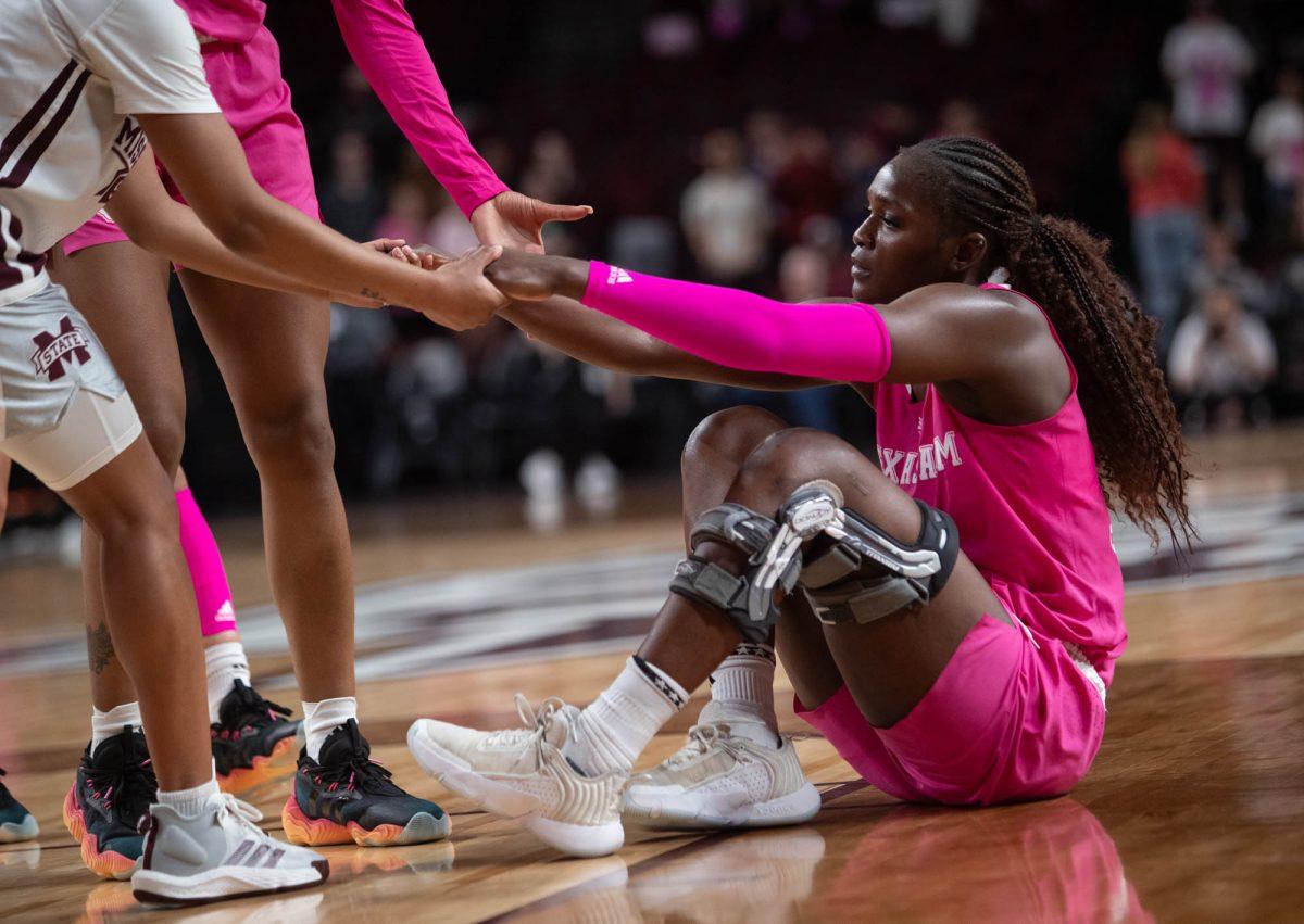 Aicha Coulibaly lifted to her feet as a devastating loss sets in for the Texas A&M womens basketball team against Mississippi State at Reed Arena on Feb 4, 2024.(Adriano Espinosa/ The Battalion)