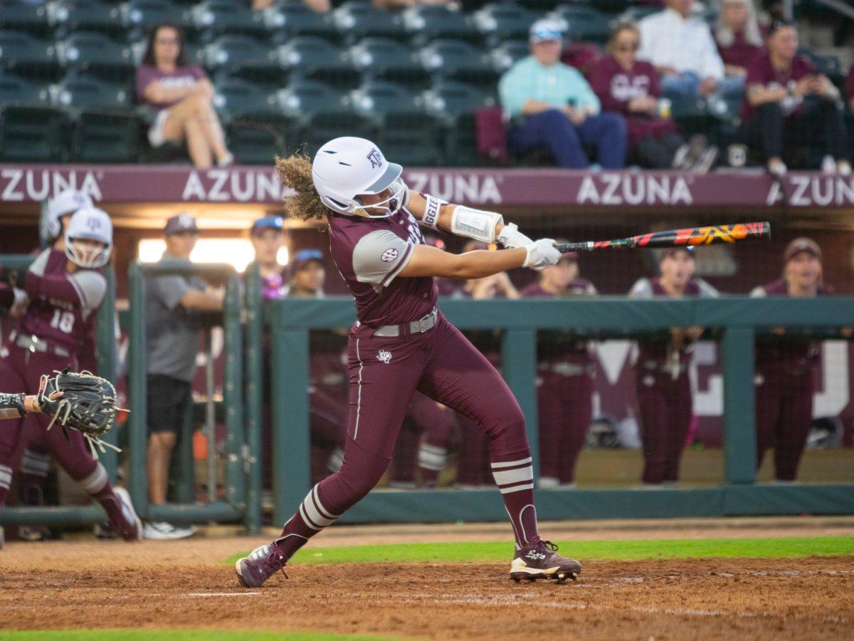 Jazmine Hill (77) making contact with the ball during Texas A&Ms game against Southeastern Louisiana on Thursday, Feb. 22, 2024 at Davis Diamond. (Hannah Harrison/The Battalion)