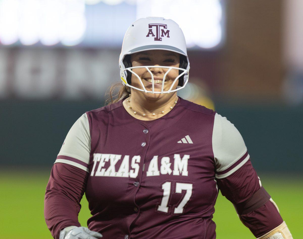 Aiyana Coleman (17) smiling after getting to first during Texas A&Ms game against Southeastern Louisiana on Thursday, Feb. 22, 2024 at Davis Diamond. (Hannah Harrison/The Battalion)