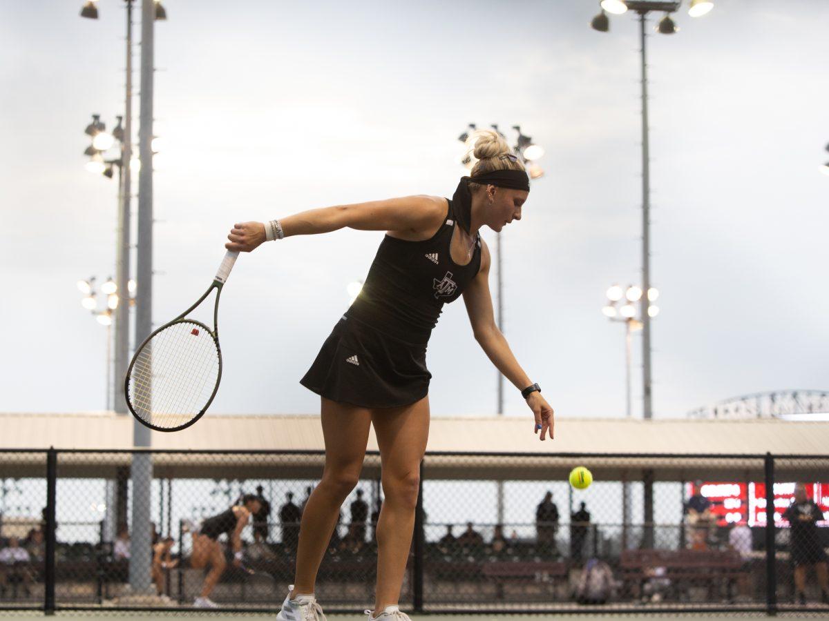 Junior Daria Smetannikov perpares to serve during Texas A&amp;M's game against SMU on Tuesday, Feb. 27, 2024 at Mitchell Tennis Center.