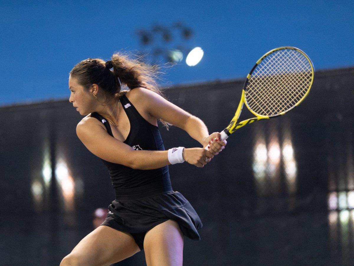 Junior Jeanette Mireles prepares to return the ball during Texas A&Ms game against SMU on Tuesday, Feb. 27, 2024 at Mitchell Tennis Center. (Hannah Harrison/The Battalion)