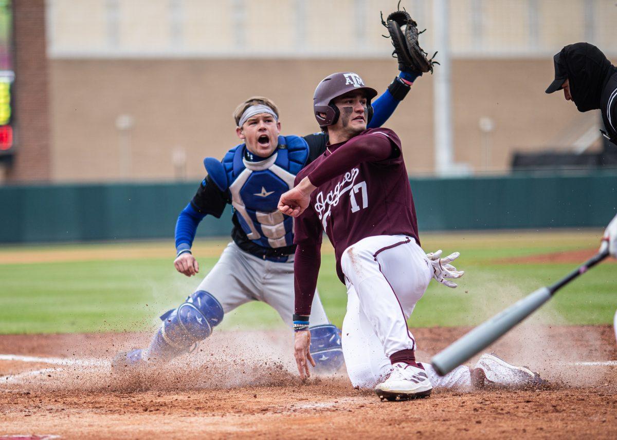 Texas A&M outfielder Jace Laviolette (17) slides into home base during Texas A&M’s game against McNeese on Saturday, Feb. 17, 2024, at Blue Bell Park. (Ishika Samant/The Battalion)