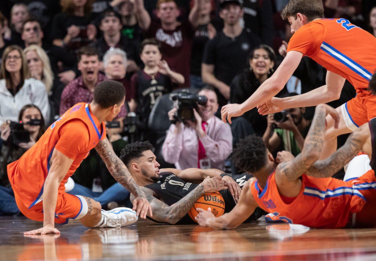 Texas A&M Aggies guard Jace Carter (0) fights for the ball during Texas A&M’s game against Florida on Saturday, Feb. 3, 2024, at Reed Arena. (Ishika Samant/The Battalion)