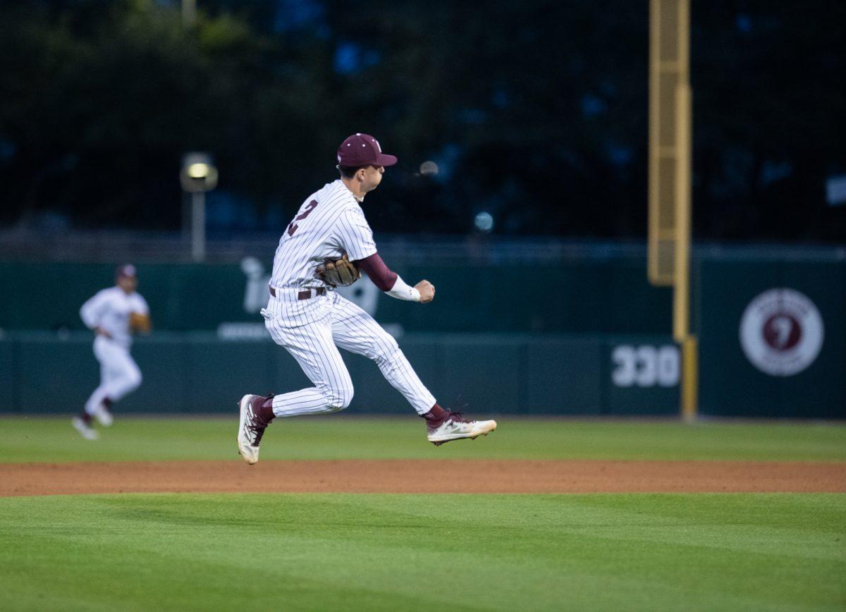 Texas A&M infielder Ali Camarillo (2) throws ball during Texas A&M’s  game against McNeese on Friday, Feb. 16, 2024, at Blue Bell Park. (Lana Cheatham/The Battalion)