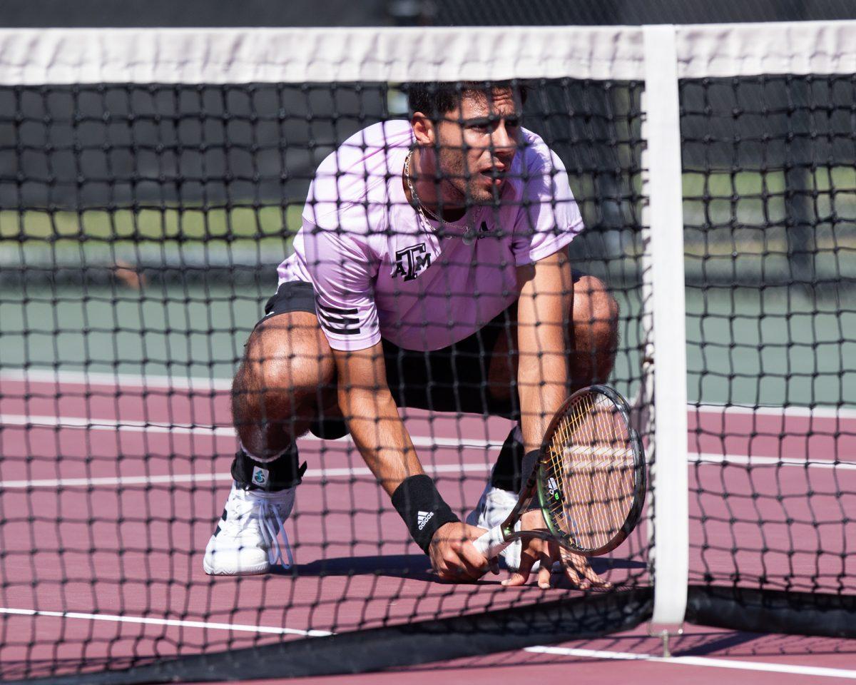 Sophomore Togan Tokac prepares for the opposing serve at Texas A&Ms match against Pepperdine on Sunday, Feb. 25, 2024, at the Mitchell Tennis Center. (© Connor May/The Battalion)