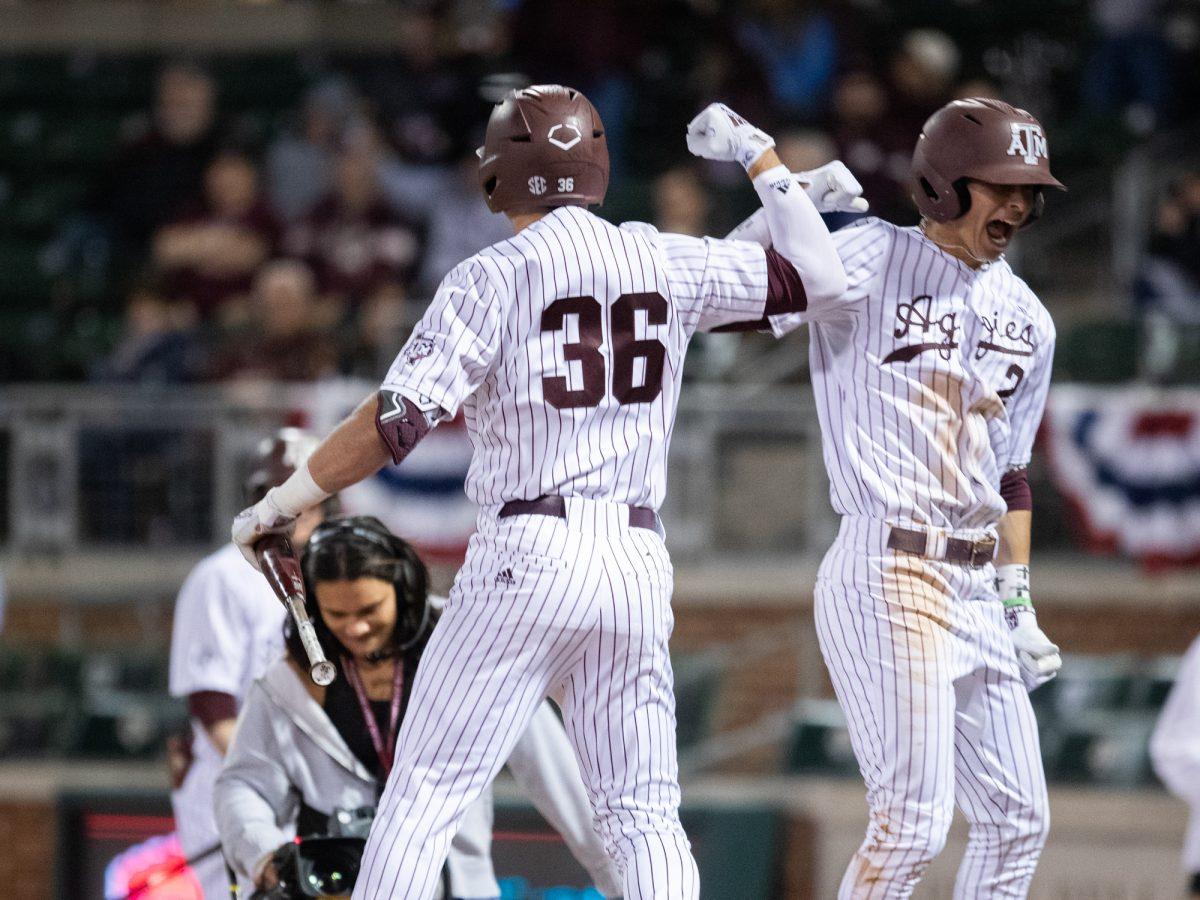 Texas A&M utility Jett Johnston (36) and Texas A&M infielder Ali Camarillo (2) celebrate during Texas A&M’s game against McNeese on Friday, Feb. 16, 2024, at Blue Bell Park. (Lana Cheatham/The Battalion)