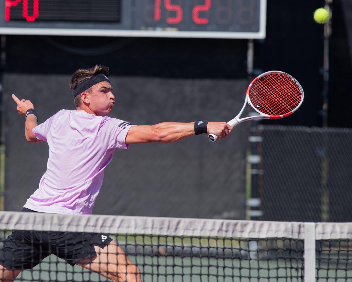 Senior Raphale Perot returns a volley at Texas A&M's match against Pepperdine on Sunday, Feb. 25, 2024, at the Mitchell Tennis Center. (© Connor May/The Battalion)