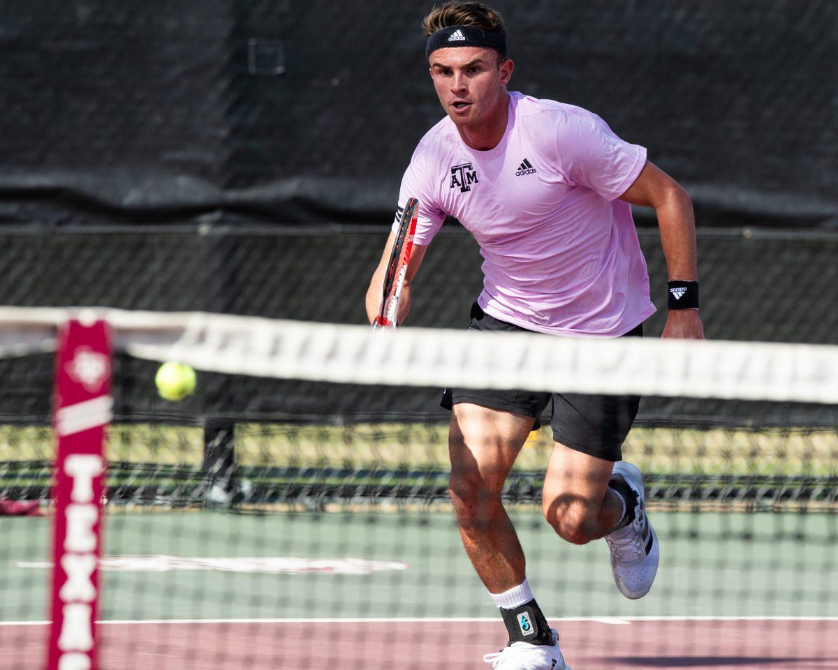 Senior Raphael Perot rushes to the ball at Texas A&Ms match against Pepperdine on Sunday, Feb. 25, 2024, at the Mitchell Tennis Center. (© Connor May/The Battalion)