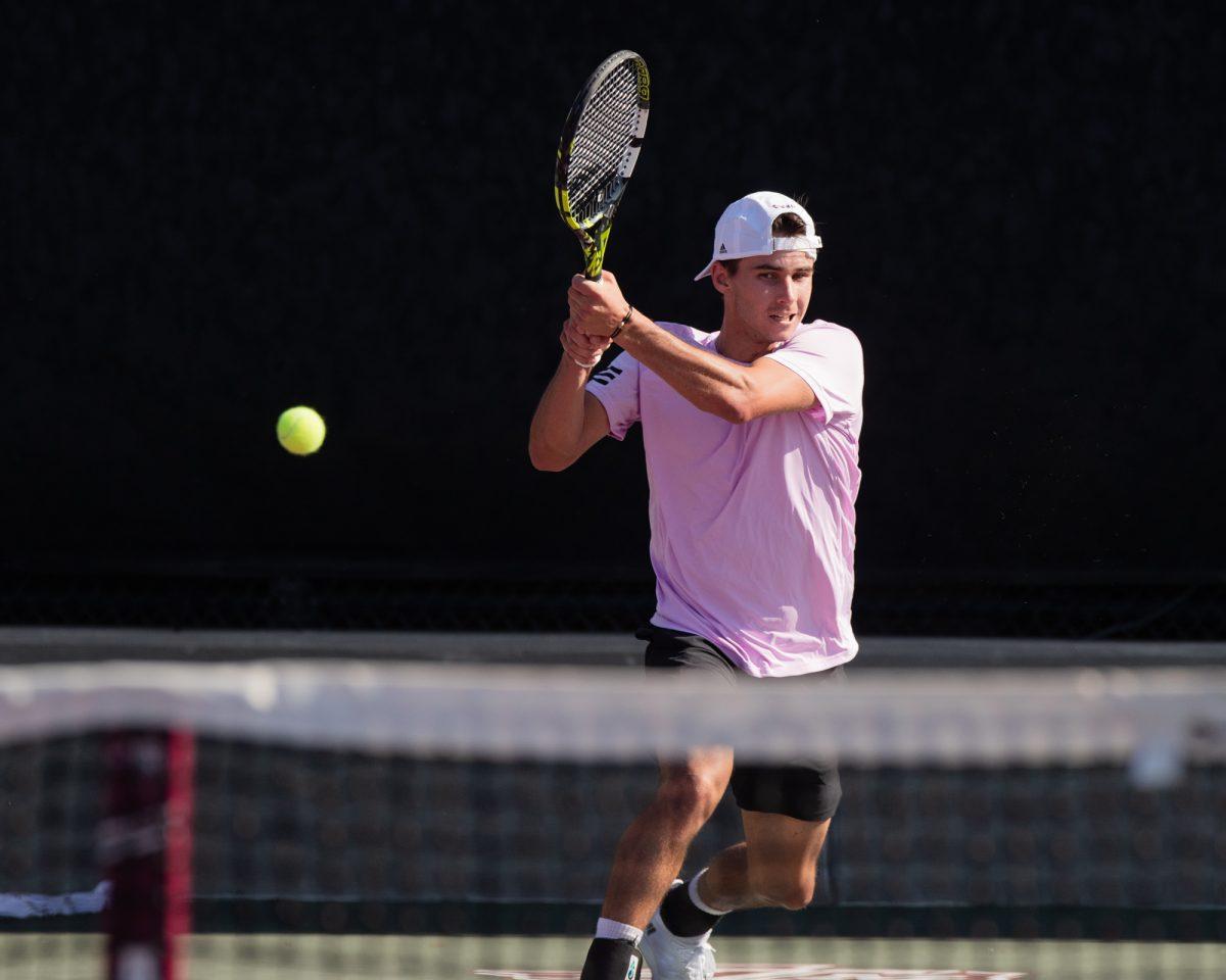 Junior Luke Casper returns the ball at Texas A&Ms match against Pepperdine on Sunday, Feb. 25, 2024, at the Mitchell Tennis Center. (© Connor May/The Battalion)