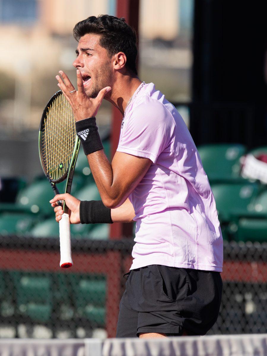 Sophomore Togan Tokac expresses frustration after a miss at Texas A&Ms match against Pepperdine on Sunday, Feb. 25, 2024, at the Mitchell Tennis Center. (© Connor May/The Battalion)