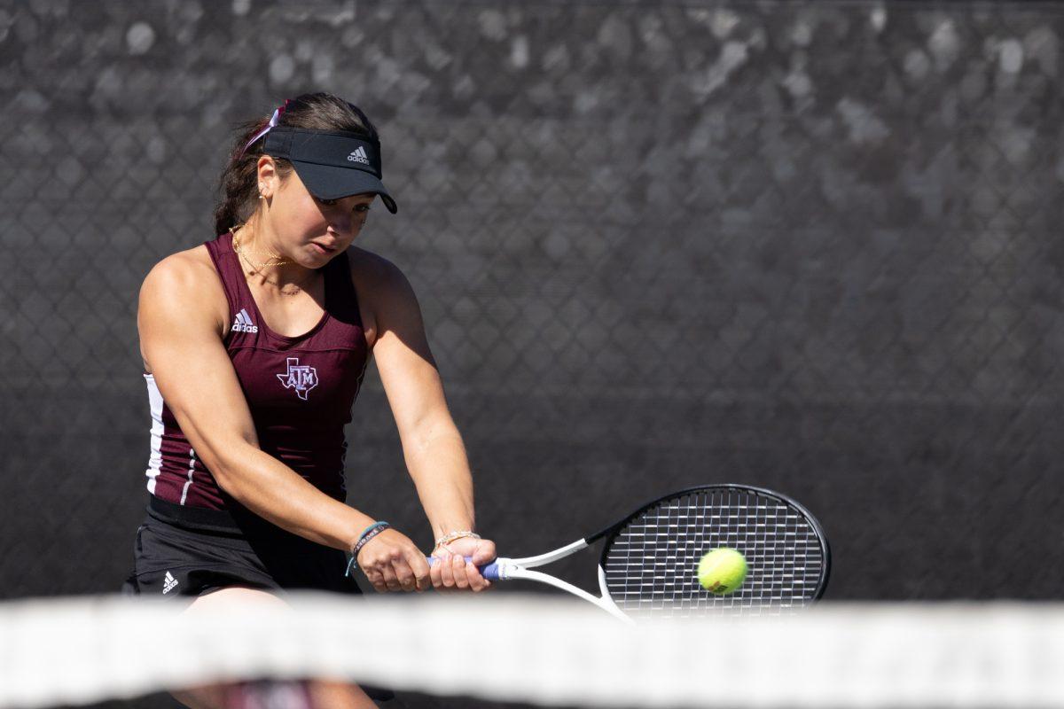 Sophomore Mia Kupres strikes during Texas A&Ms match against Rice on Saturday, Feb. 18, 2024, at Mitchell Tennis Center. (Adriano Espinosa/ The Battalion).